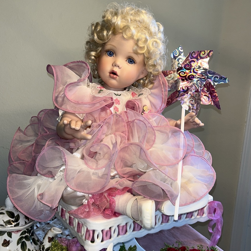 Marie Osmond’s Rose porcelain doll, “Child’s Play Rose”. She is a tottler.